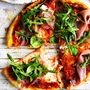 Rocket prosciutto pizza